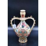 A large ornate Zolnay vase. It does have some damage but does not detract from the item. 15 inches