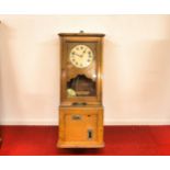 1920s Oak clocking in clock in lovely condition & it certainly sounds like its in working order (