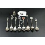 x8 Silver collectable spoons & silver thimble. (Approx 76 grams)