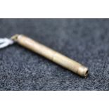 A 9ct gold toothpick with engine turned decoration - 5 grams