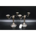 A pair of silver hallmarked candle sticks. Birmingham 1961 (filled) overall weight 1110 grams