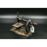 Vintage baby sewing machine, with gold decoration