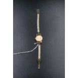 9ct gold ladies Omega watch including the bracelet in working condition (overall weight 16grams)