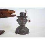 A Ethnic bronze bust and a Pitcairn Miro wood flying fish AF