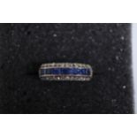 A pave set sapphire and diamond ring set in 14ct yellow gold