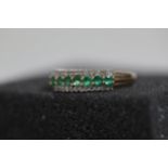 Emerald and diamond ring set in yellow 9ct gold