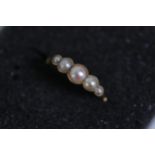 A 5 stone antique pearl ring set in 18 ct yellow gold