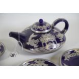 Cobalt blue teapot tea bowls and saucers with silver metal overlay