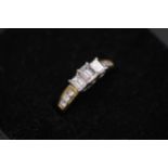 3 Emerald cut diamonds Cathedral set 18ct yellow gold ring