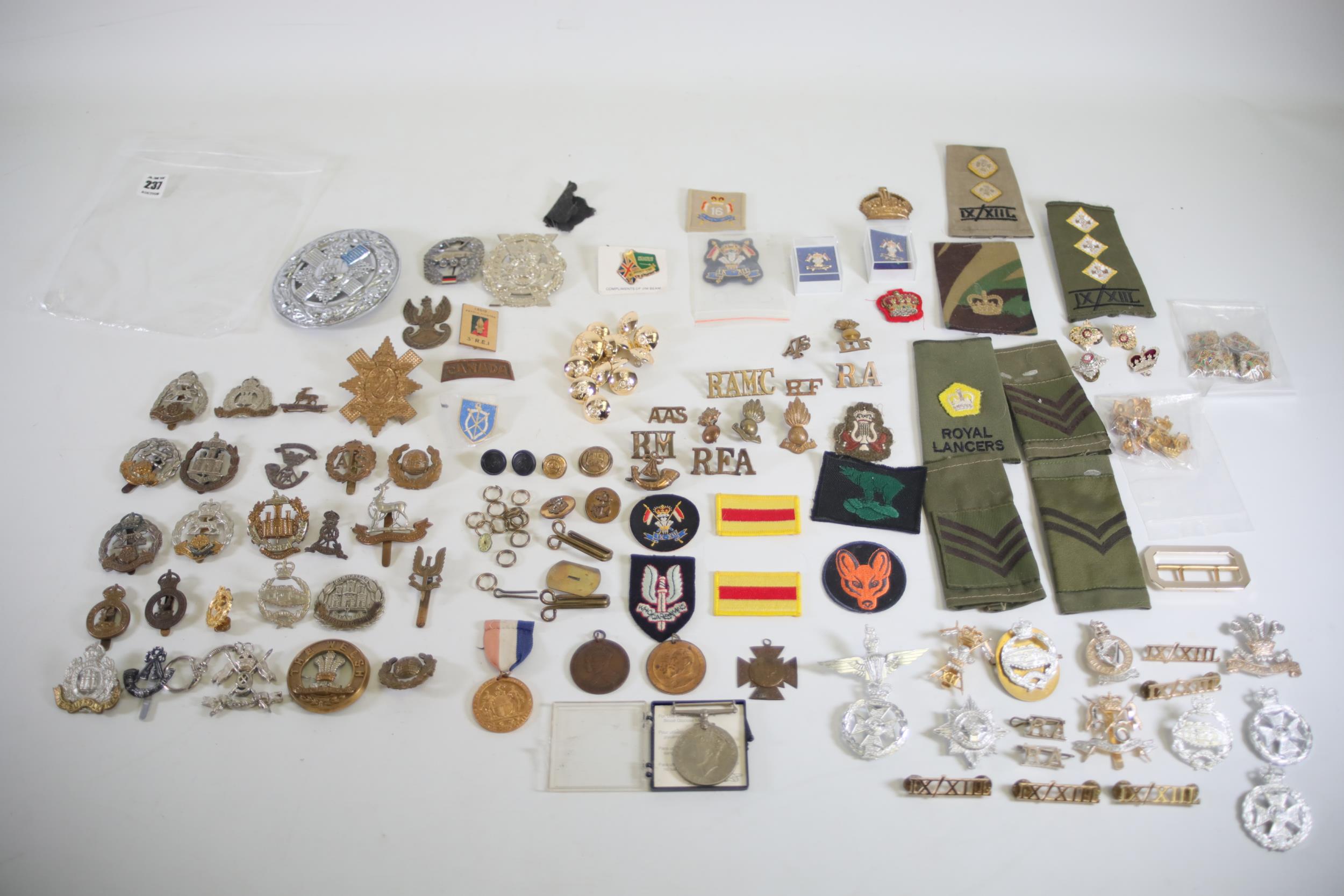 37 Military Cap Badges plus shoulder titles buttons etc