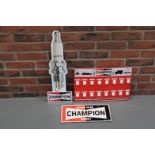 Three Champion Spark Plug Signs