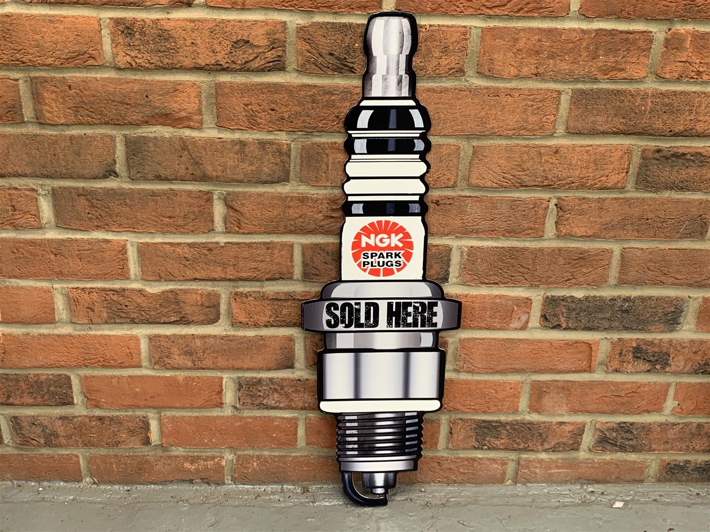 Metal NGK Spark Plugs Sold Here " Sign"