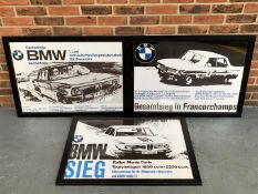 Three BMW Framed Racing Prints On Plastic Board