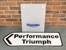 Two Plastic Triumph Signs