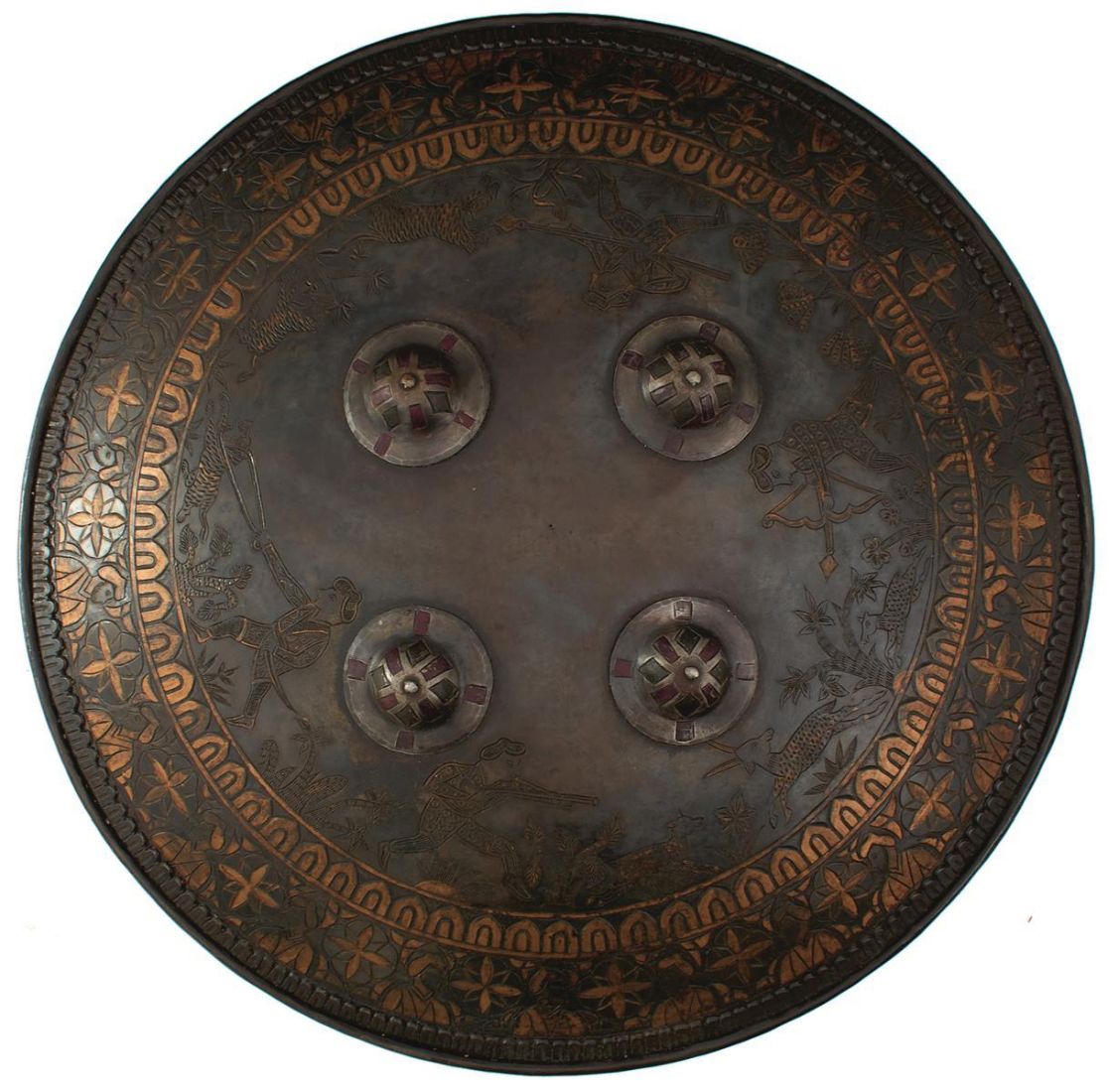 A SIKH INFLUNCED SHIELD OR DHAL, 44cm diameter steel body decorated with hunting scenes amidst