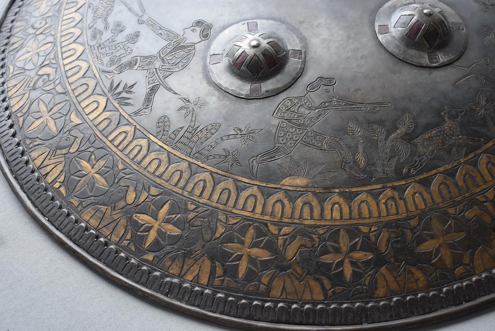 A SIKH INFLUNCED SHIELD OR DHAL, 44cm diameter steel body decorated with hunting scenes amidst - Image 6 of 9