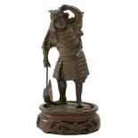 A BRONZE FIGURE OF A SAMURAI WARRIOR, standing and looking in to the distance with axe in his