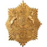 A ROYAL ARTILLERY NCO'S BELL TOP SHAKO PLATE, the gilt rayed star embossed with a crowned Hanoverian