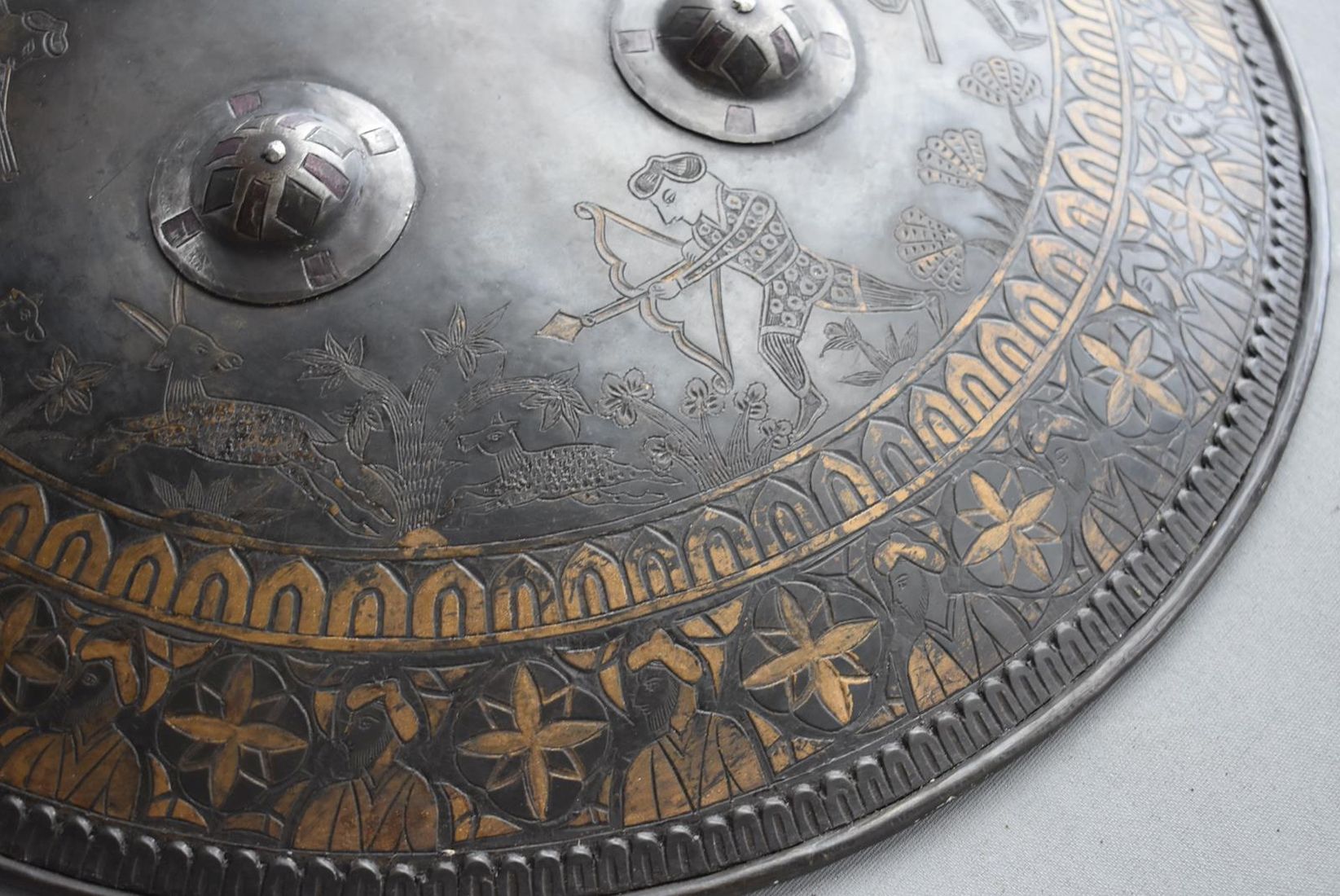 A SIKH INFLUNCED SHIELD OR DHAL, 44cm diameter steel body decorated with hunting scenes amidst - Image 3 of 9