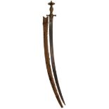 A 19TH CENTURY INDIAN TULWAR, 75cm curved blade, characteristic brass hilt chiselled and reeded,