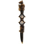 A TIBETAN BRONZE PHURBA, 11cm triangular section incurved spike blade decorated with snakes and