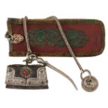 A 19TH CENTURY AND LATER MONGOLIAN TOBACCO POUCH AND ACCOUTREMENTS, comprising white metal mounted
