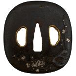 A ROUNDED SQUARE IRON TSUBA, decorated with prunus blossom in silver, gold lined hitsu-ana,