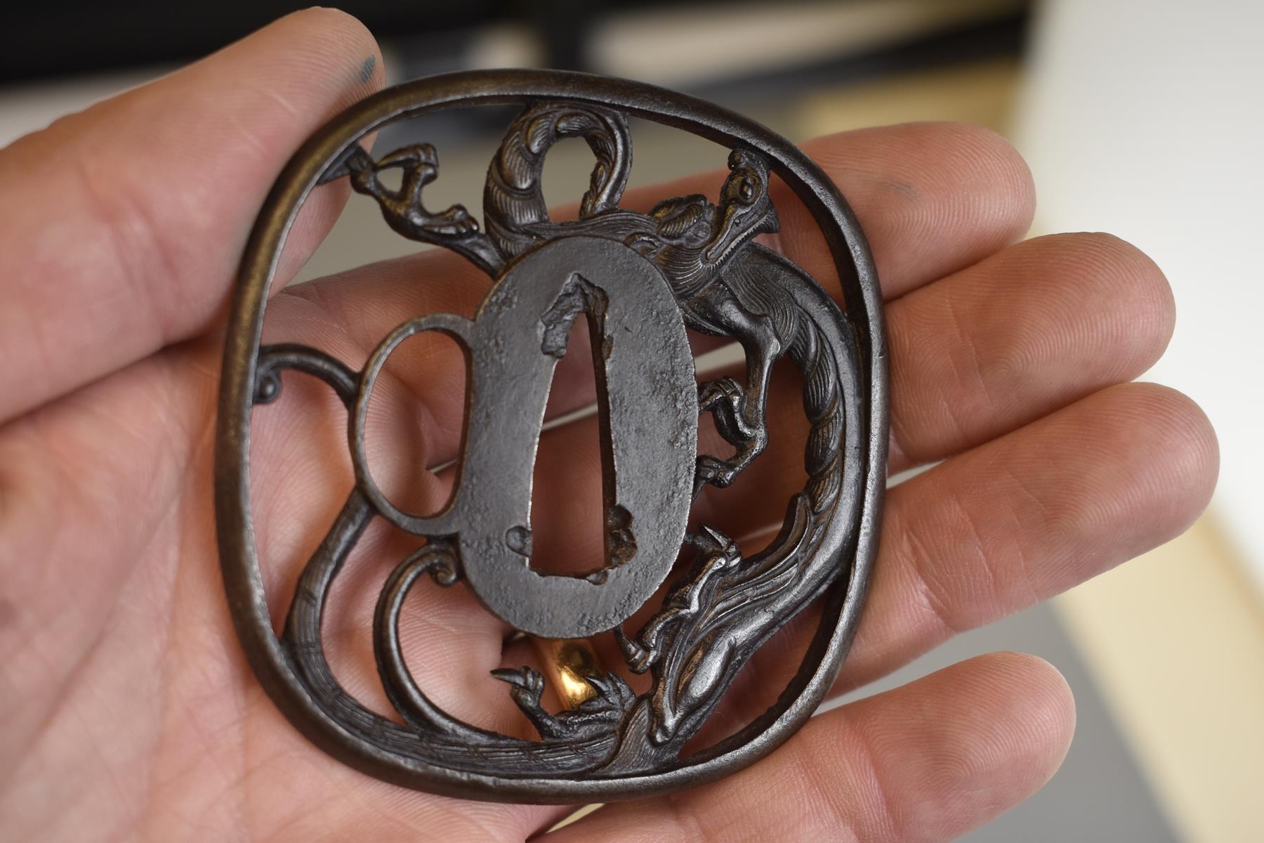 AN IRON SUKASHI TSUBA, chiselled and pierced with a dragon, in wood box, 7.4cm. - Image 3 of 6