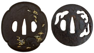 TWO IRON TSUBA, the first circular and pierced with stylized pine trees in the mist, signed Shoami