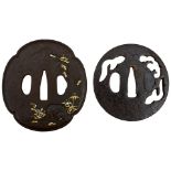 TWO IRON TSUBA, the first circular and pierced with stylized pine trees in the mist, signed Shoami