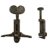 A MAIN SPRING CLAMP, with heart-form top, together with a frizzen spring clamp. (2)