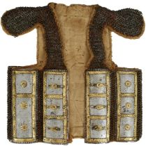 A RARE 17TH CENTURY INDIAN MAIL AND PLATE ARMOUR, the cloth backed jerkin form body with nine chest,