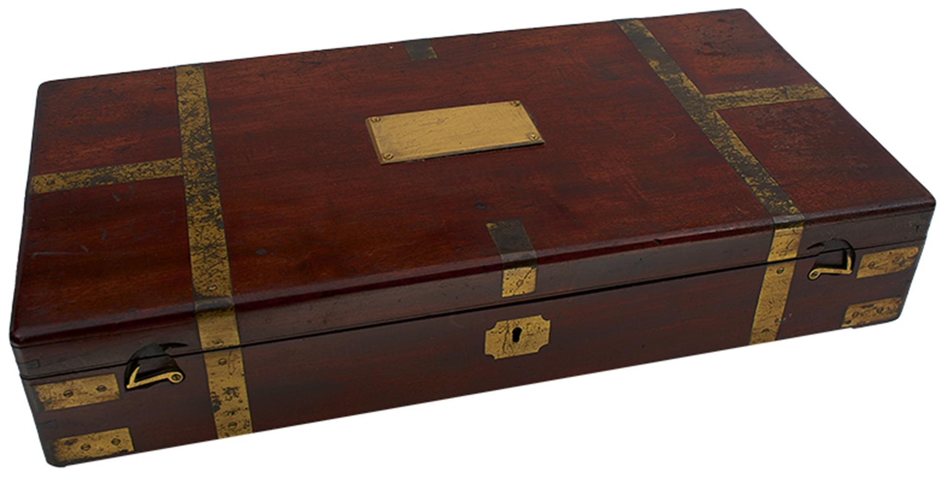 A CAMPAIGN BOX FITTED FOR A PAIR OF PISTOLS, the brass bound mahogany case with later pink velvet
