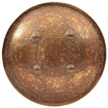 A 19TH CENTURY INDIAN DHAL OR SHIELD the 39cm diameter body with turned rim profusely decorated with