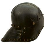 A LATE 15TH CENTURY ITALIAN CELATA OR SALLET, the single piece skull drawn up to a raised medial