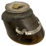 A SILVER MOUNTED 7TH QUEEN'S OWN HUSSARS HORSE'S HOOF INKWELL, the hinged lid hallmarked for