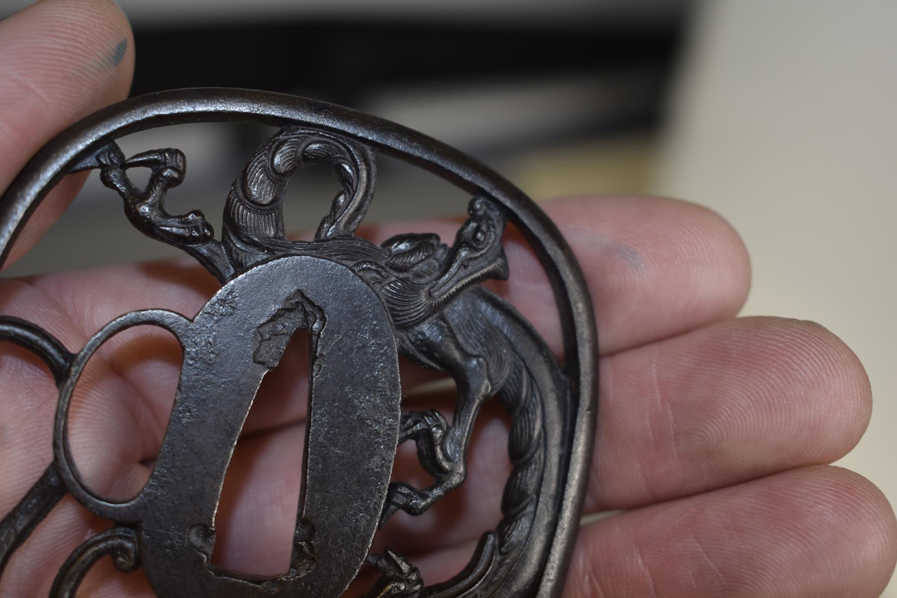 AN IRON SUKASHI TSUBA, chiselled and pierced with a dragon, in wood box, 7.4cm. - Image 4 of 6