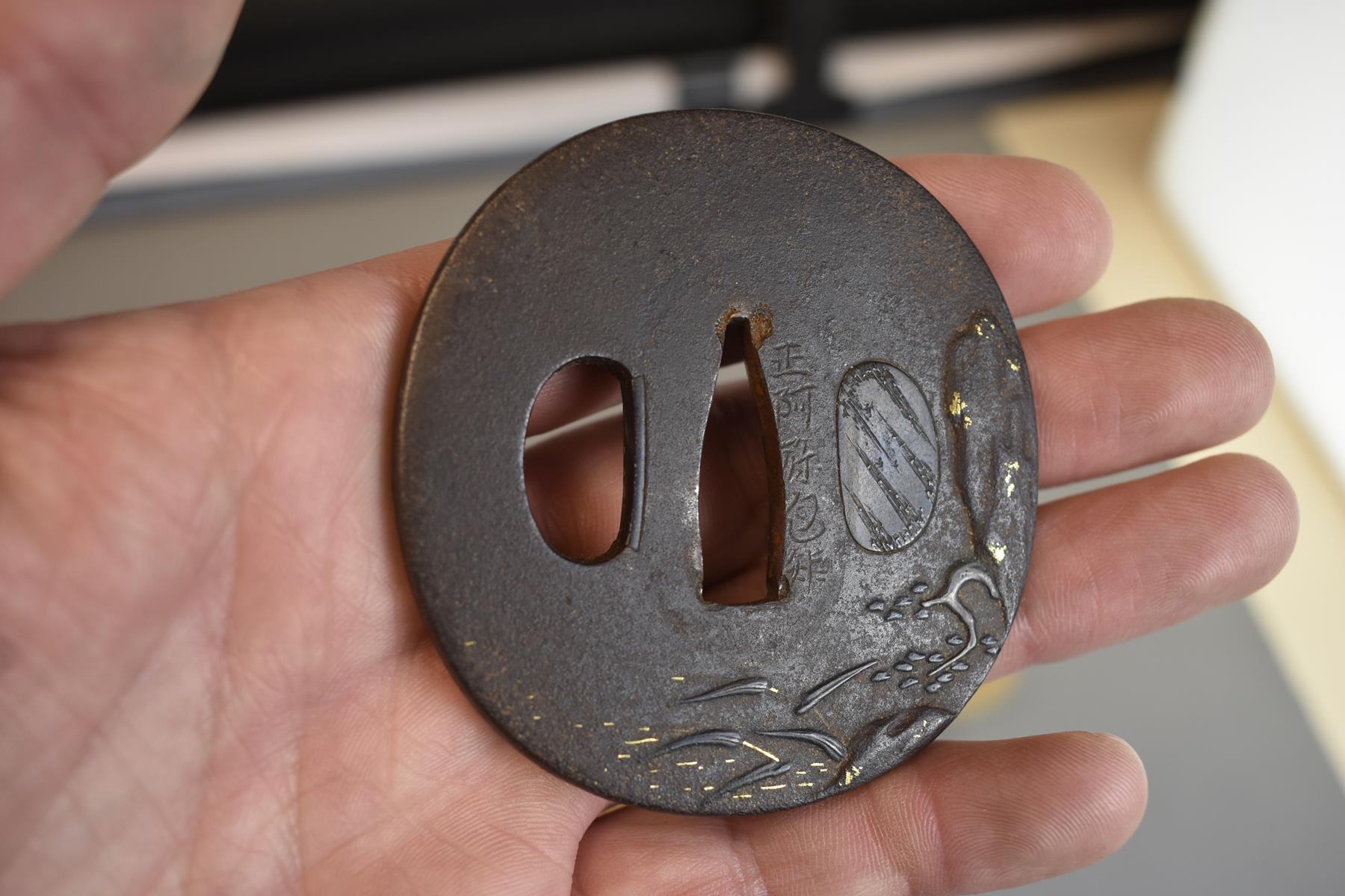 THREE CIRCULAR IRON TSUBA, the first chiselled with a landscape, soft metal details, the second with - Image 3 of 8