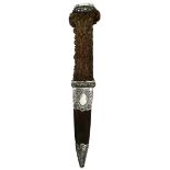 A LARGE WHITE METAL MOUNTED STAG'S HORN SGEAN DUBH, 8cm blade with faceted back edge, large