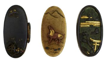 THREE PAIRS OF FUCHI-KASHIRA, the first of shakudo decorated with a tori and presents in the rain,