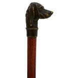 A 19TH CENTURY SWORD STICK, the bronze pommel cast as a hound's head, 65cm square section tapering