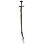 A 19TH CENTURY INDIAN TULWAR OR SWORD, 74.5cm heavy clipped back fullered blade decorated with large