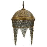 A 19TH CENTURY INDIAN KULAH KHUD OR HELMET, the iron bowl gold damascened overall with flowering