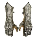 A PAIR OF LATE 15TH CENTURY SOUTH GERMAN, LANDSHUT, GOTHIC GAUNTLETS, the cuffs sharply drawn out to