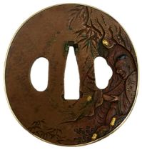 A CIRCULAR COPPER TSUBA, decorated with a figure in a cave within a landscape, gold and shakudo