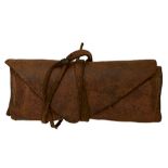 A 19TH CENTURY LEATHER FLINT WALLET, the chamois leather body with pockets for six flints and a