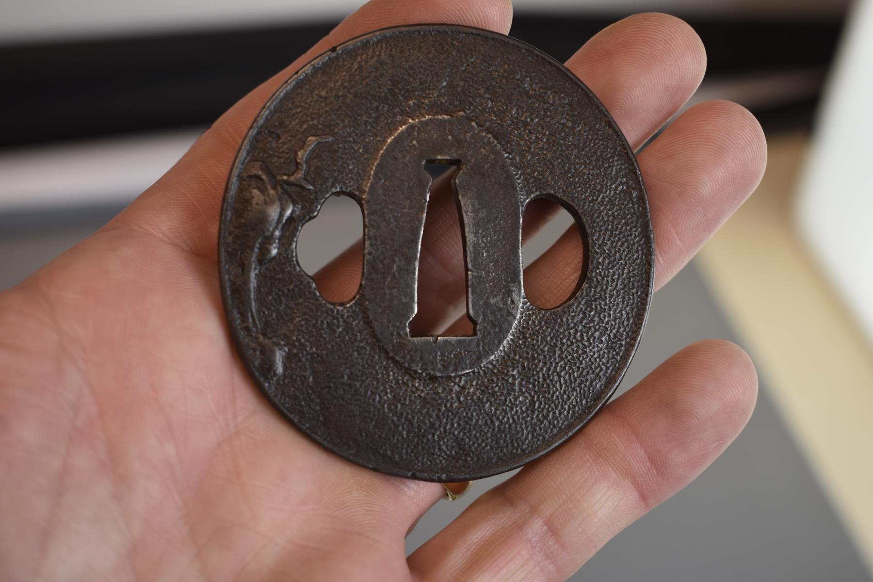 A CIRCULAR IRON TSUBA, decorated with a bird in flight over a rocky landscape, signed Toshitsugu - Image 5 of 5