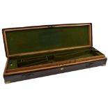 A LEATHER COVERED OAK GUN CASE, the green baize lined interior for a gun with 30inch barrels,