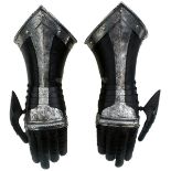 A PAIR OF GERMAN BLACK AND WHITE GAUNTLETS IN THE 17TH CENTURY STYLE, turned and roped cuffs with