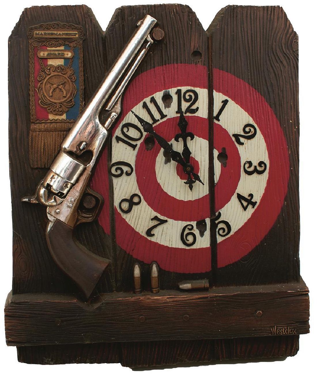 A WESTCLOX MARKSMANSHIP AWARD CLOCK, depicting a Colt Army revolver in front of a target, battery